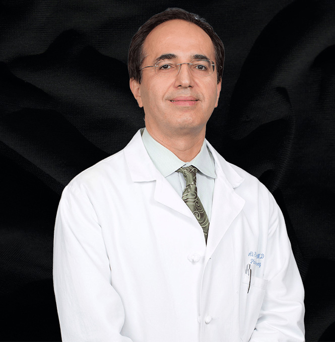 Dr. Sajjadian in a white coat with black background